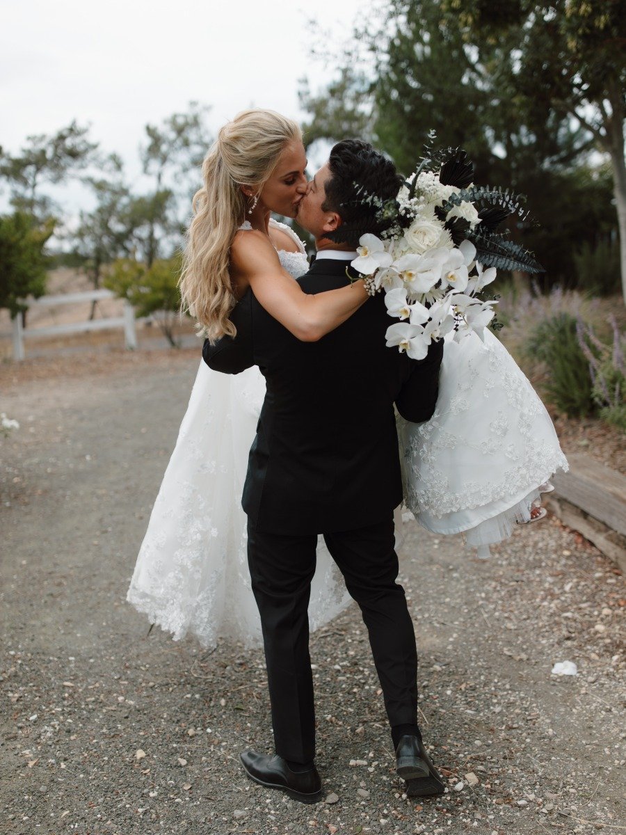 A black-tie vineyard wedding with an all-black dress code for guests